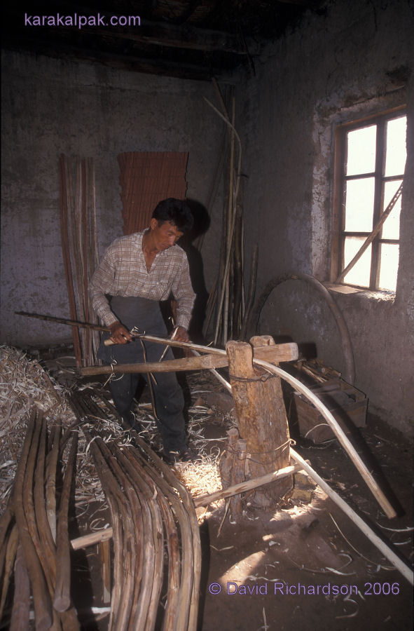 Shaving the bent poles to make the finished uyiqs